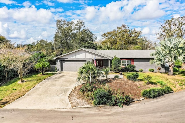 ranch-style home featuring a garage and a front yard