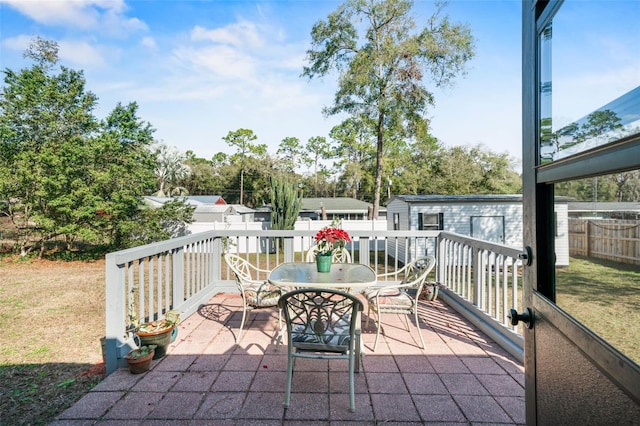 view of patio featuring an outbuilding