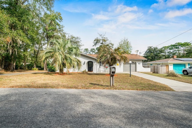 view of front of house featuring a garage and a front yard