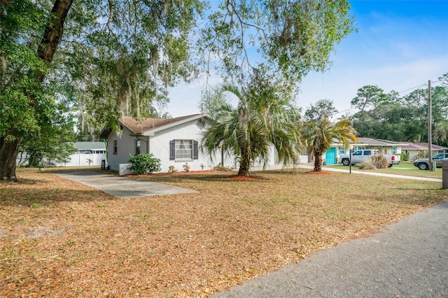 ranch-style home with a front lawn