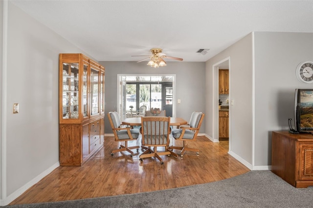 dining area featuring light hardwood / wood-style floors and ceiling fan