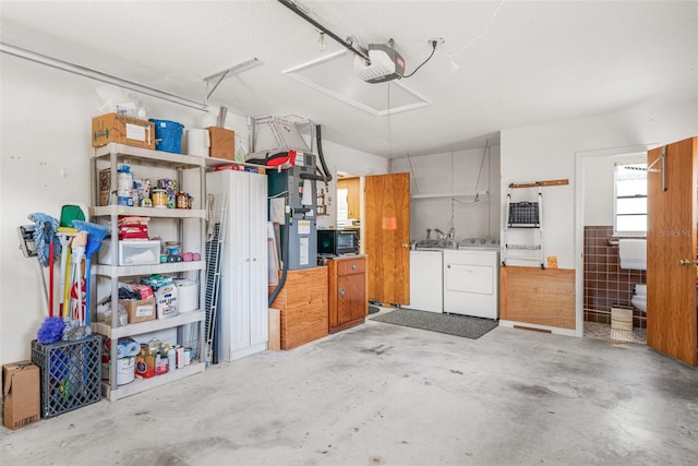 garage featuring a garage door opener and washer and clothes dryer