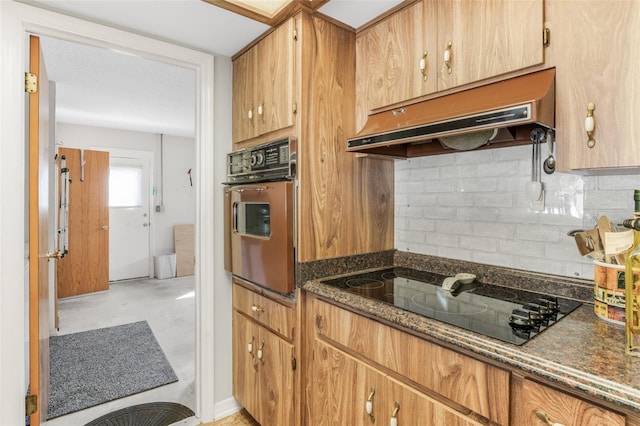 kitchen with range hood, dark stone countertops, decorative backsplash, wall oven, and black electric cooktop