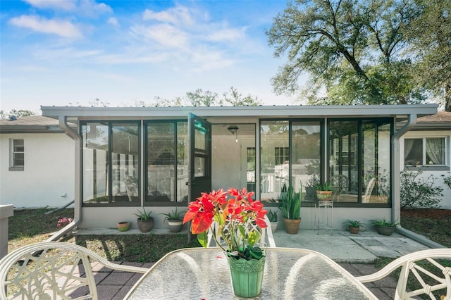 back of property featuring a sunroom