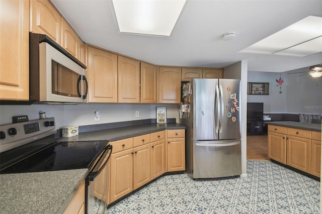 kitchen with ceiling fan and stainless steel appliances