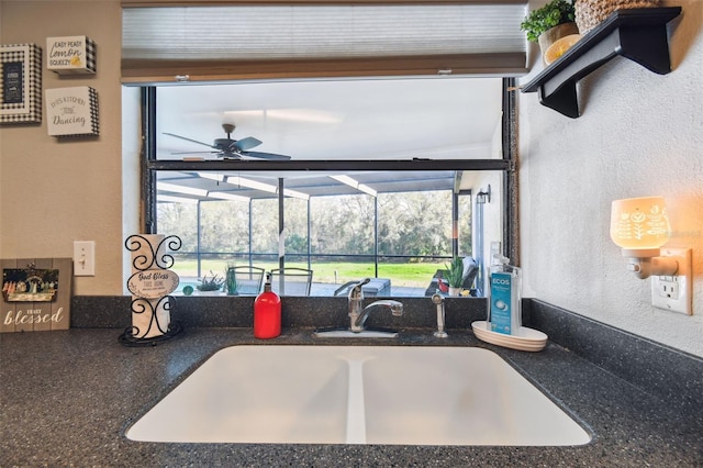 kitchen with ceiling fan and sink