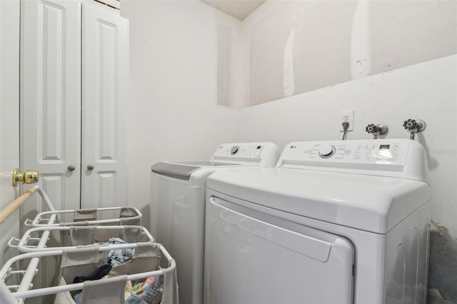 washroom with independent washer and dryer