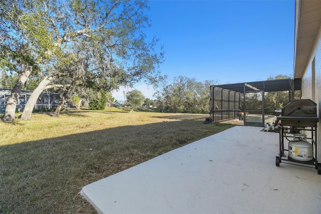 view of yard with a patio and glass enclosure