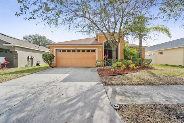 view of front of property featuring a garage and a front lawn