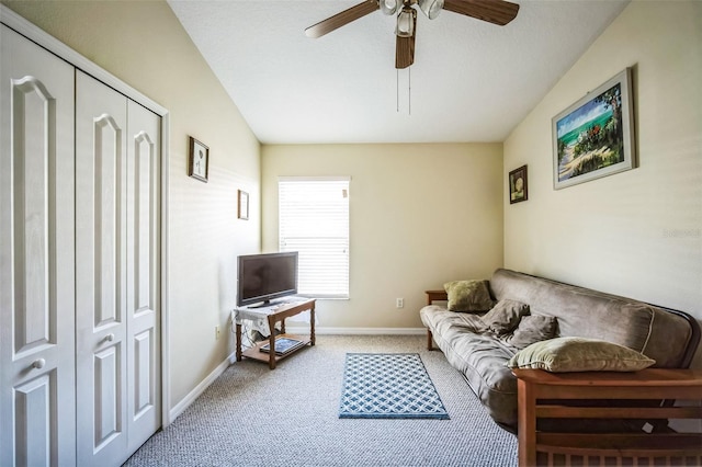 carpeted living room featuring ceiling fan