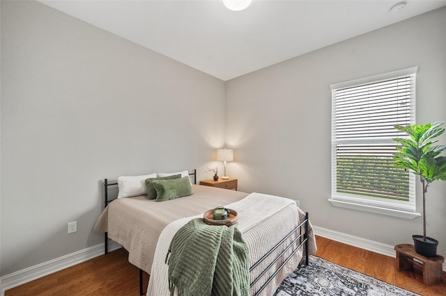 bedroom featuring dark hardwood / wood-style flooring