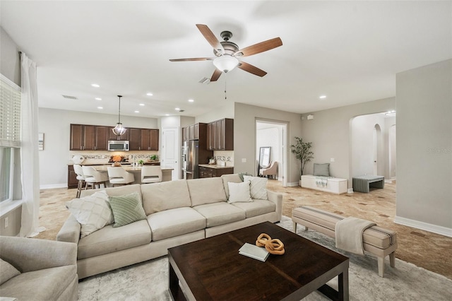 living room with ceiling fan