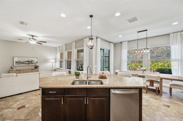 kitchen featuring dark brown cabinets, dishwasher, sink, and hanging light fixtures