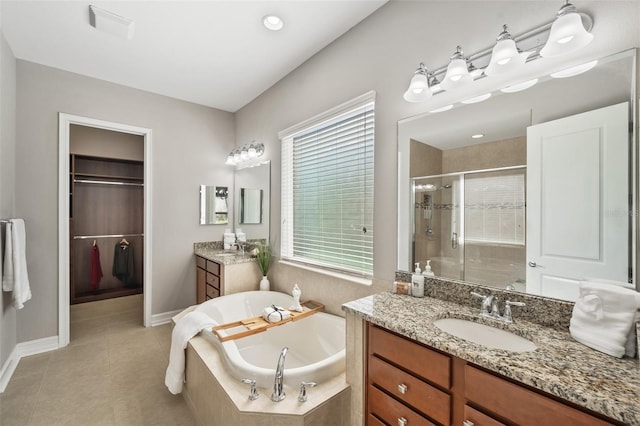 bathroom with vanity, tile patterned floors, and independent shower and bath