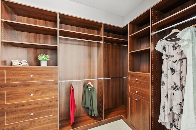 spacious closet with tile patterned flooring