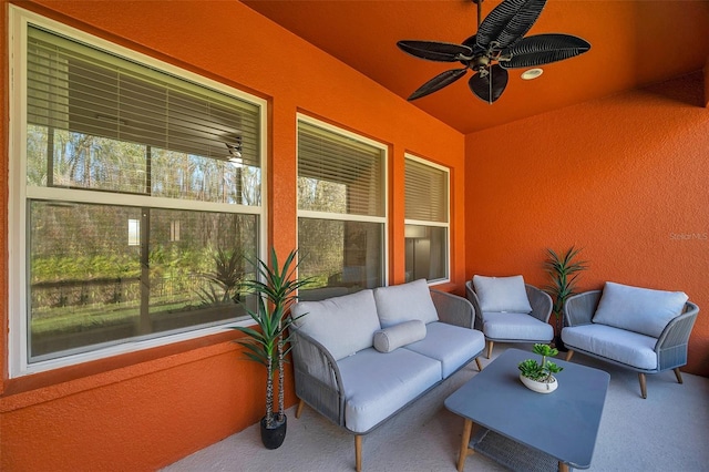 view of patio with outdoor lounge area and ceiling fan