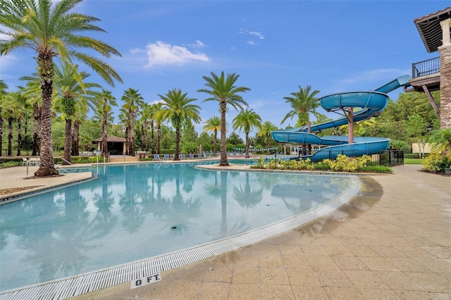 view of pool with a water slide