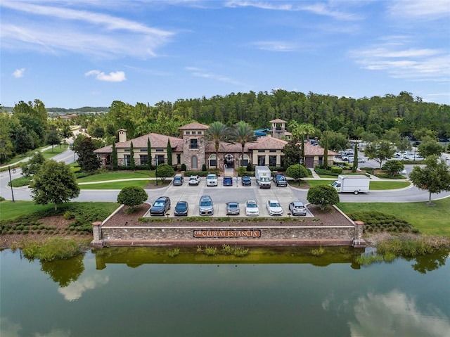 birds eye view of property with a water view