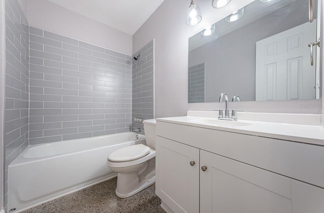 full bathroom with vanity, tiled shower / bath combo, and toilet