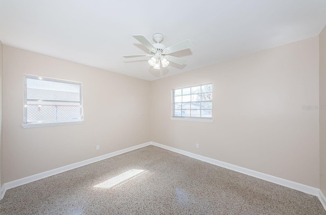 empty room featuring ceiling fan