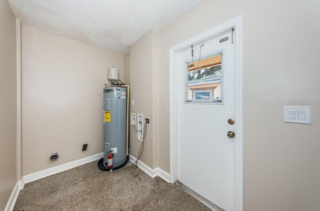 utility room featuring water heater