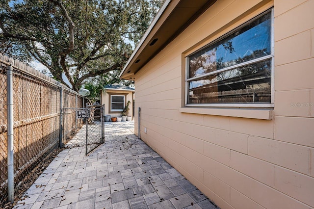 view of side of home featuring a patio area