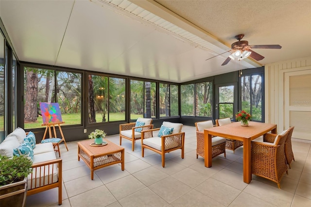 sunroom featuring ceiling fan