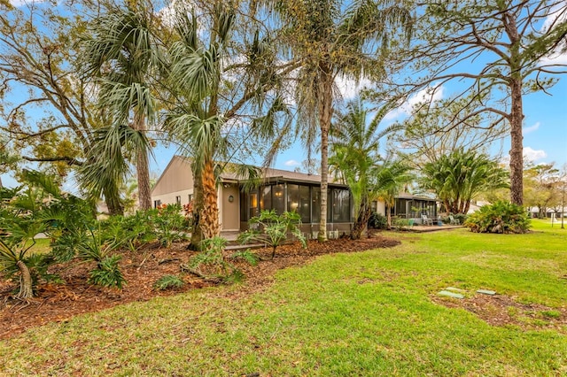 view of yard featuring a sunroom