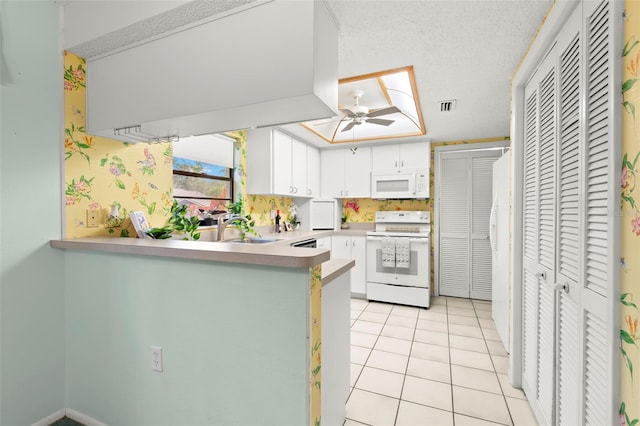 kitchen with visible vents, a ceiling fan, light tile patterned flooring, a sink, and white appliances