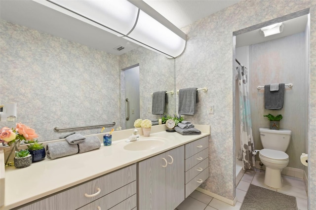 bathroom with a shower with curtain, visible vents, toilet, vanity, and tile patterned flooring