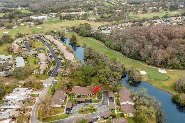 aerial view with a residential view, a water view, and golf course view