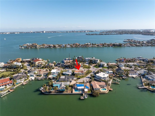 bird's eye view featuring a residential view and a water view