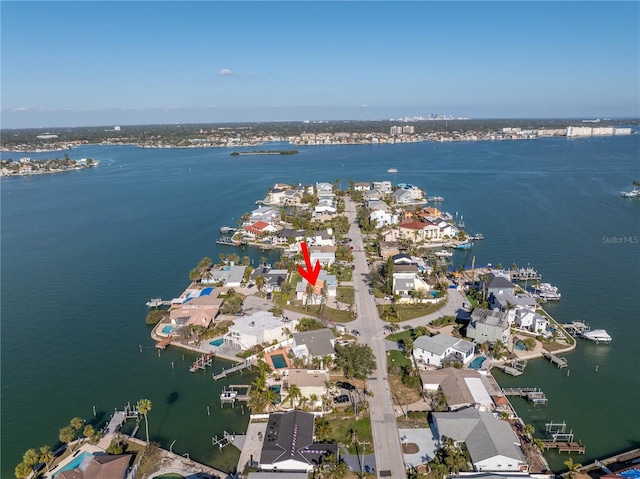 birds eye view of property featuring a water view and a residential view