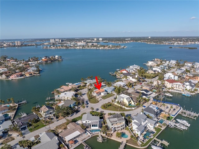 birds eye view of property featuring a water view and a residential view