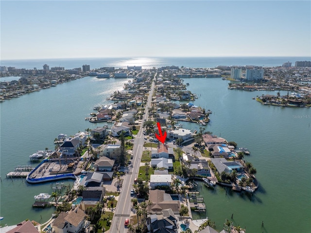 drone / aerial view featuring a view of city and a water view