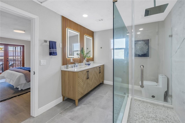 full bath featuring a stall shower, visible vents, toilet, ensuite bathroom, and french doors