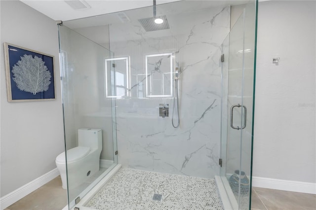 full bath with a marble finish shower, visible vents, toilet, tile patterned flooring, and baseboards