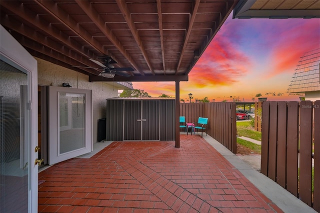 14505 Catalina Cir, Seminole, FL 33776 - patio terrace at dusk featuring ceiling fan