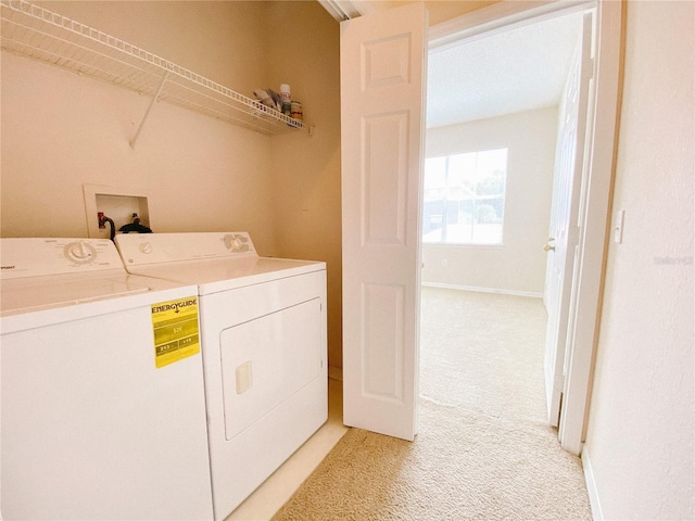 18001 Richmond Place Dr Unit 222, Tampa, FL 33647 - laundry area with washer and dryer and light carpet