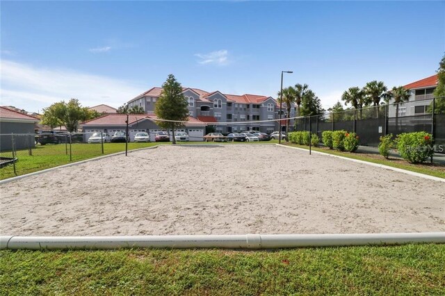 18001 Richmond Place Dr Unit 222, Tampa, FL 33647 - view of home's community with a lawn and volleyball court