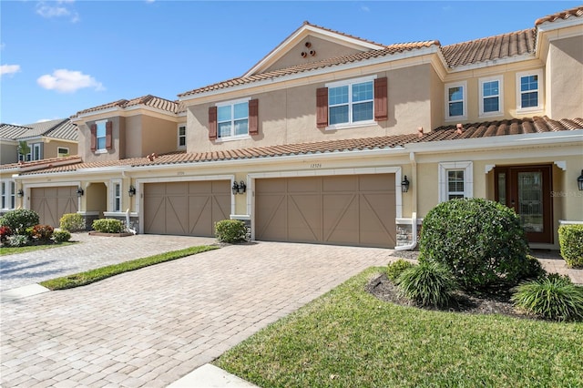 mediterranean / spanish-style house featuring a garage