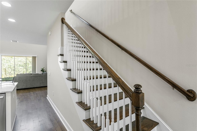 staircase with recessed lighting, baseboards, and wood finished floors