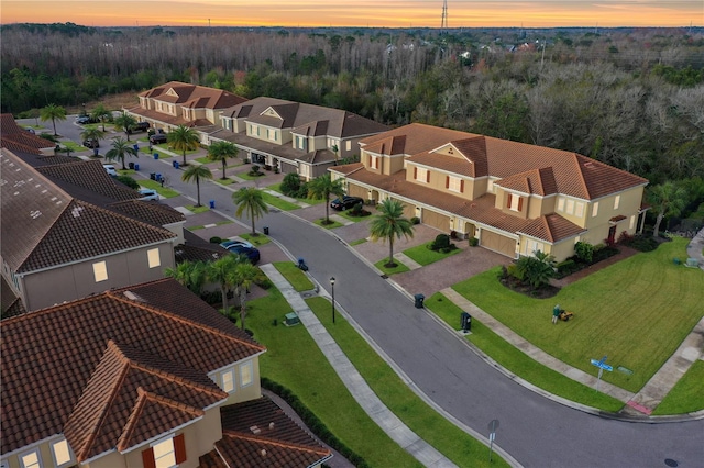 aerial view with a residential view and a wooded view