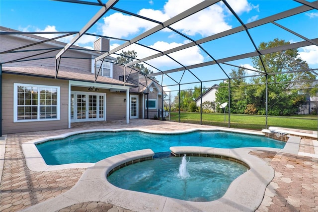 view of pool with a lanai, a pool with connected hot tub, a patio, and french doors