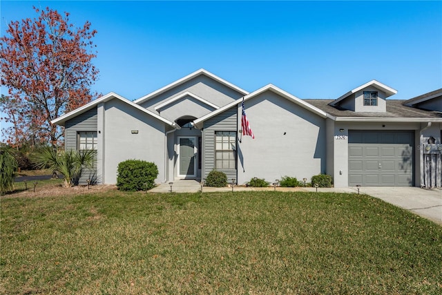 ranch-style house with a garage and a front lawn