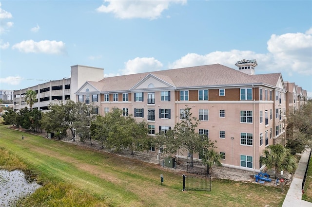 4221 W Spruce St Unit 1414, Tampa, FL 33607 - view of property featuring central air condition unit