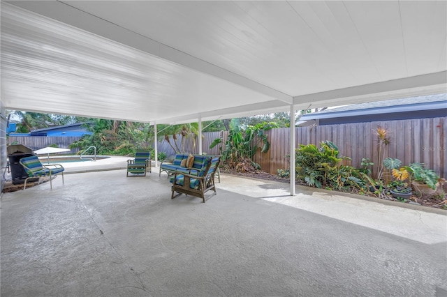 view of patio / terrace with a fenced backyard and a fenced in pool