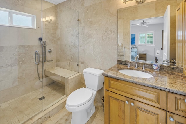 ensuite bathroom with toilet, a wealth of natural light, a shower stall, and connected bathroom