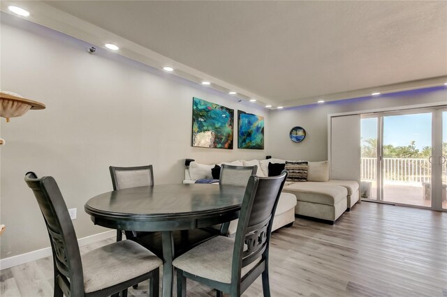 7432 Sunshine Skyway Ln S Unit 206, Saint Petersburg, FL 33711 - dining space with light hardwood / wood-style flooring