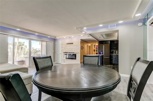 7432 Sunshine Skyway Ln S Unit 206, Saint Petersburg, FL 33711 - dining space featuring light wood-type flooring